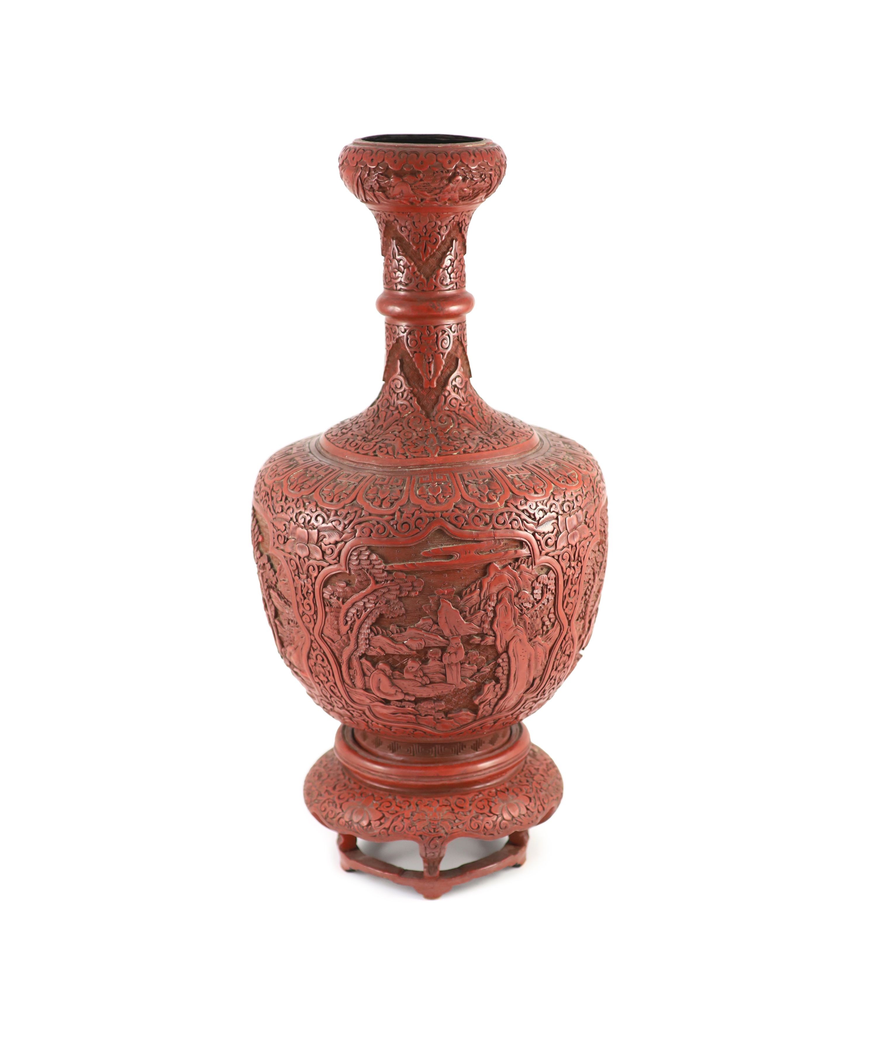 A large Chinese cinnabar lacquer garlic-neck vase and stand, c.1900, Total height 60.5 cm, base of vase drilled